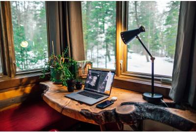 A home office with snow outside