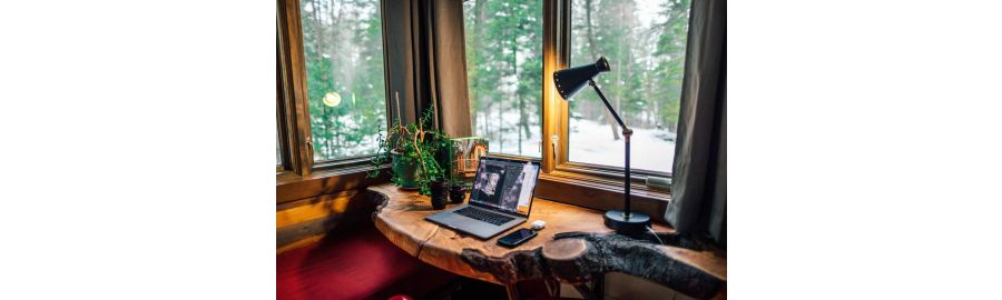 A home office with snow outside