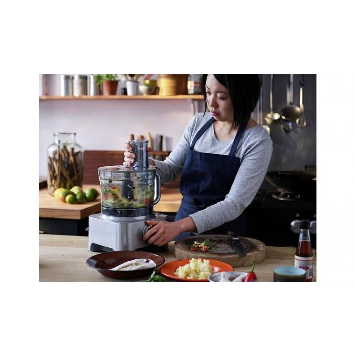 A woman using the Kenwood multipro sense food processor