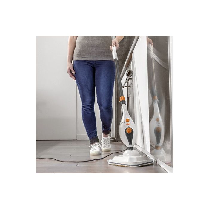 A Vax steam glide lightweight multifunctional steam cleaner being used on a tiled floor